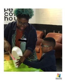 One of our parents and kiddos enjoying our slime table!